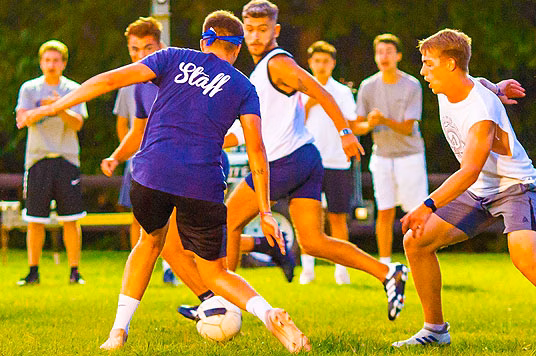 Football coach at a summer camp in the United States - You’ll gain hands-on coaching experience, develop your leadership and communication skills, and spend your summer doing what you love